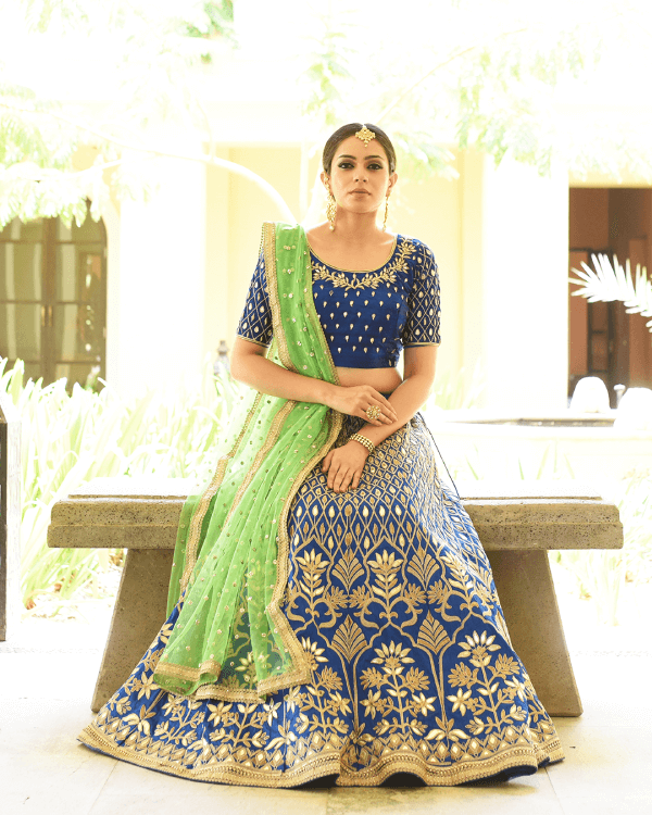 Woven Zari Banarasi silk lehenga choli in Blue and Green